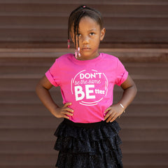 DON'T BE THE SAME BE BETTER. Kids PINK graphic tee